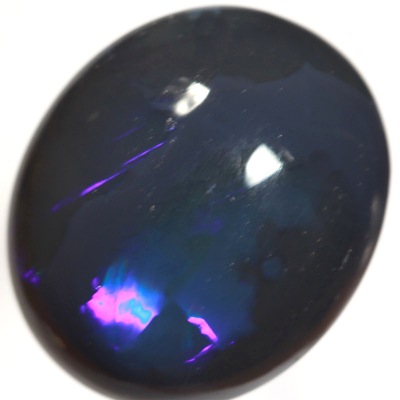 SOLID BLACK OPAL Huge opal with rolling flashes of electric blue. SEE VIDEO